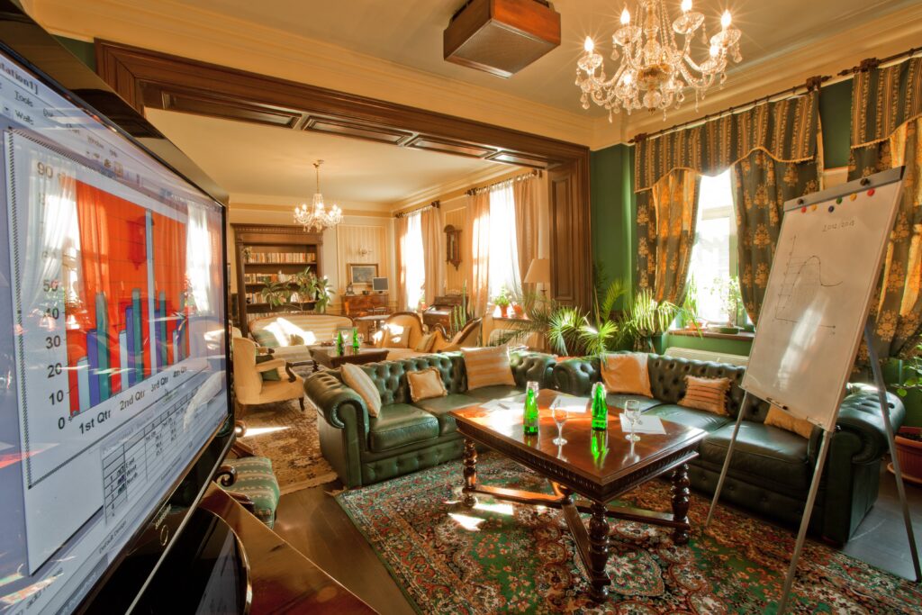 Stylish lounge with TV and presentation board.