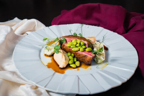 Photo of Duck breast in Teriyaki sauce with spinach malfatti and edamame